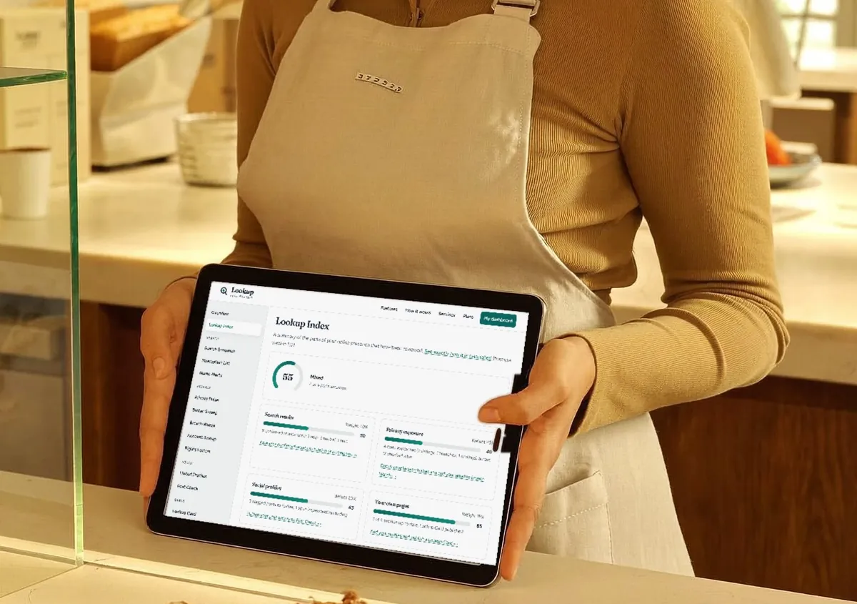Shop owner checking her Lookup Index on a tablet behind the counter